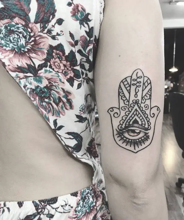 hamsa hand tattoo on back of arm