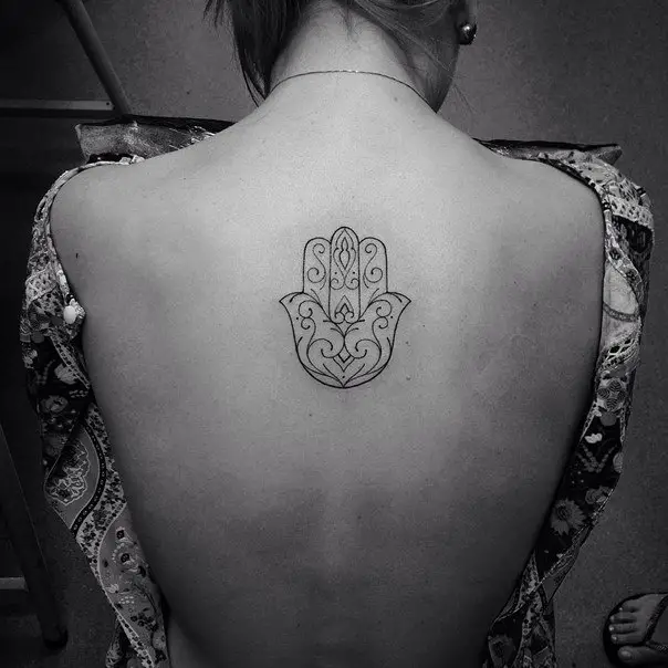 hamsa hand tattoo on back