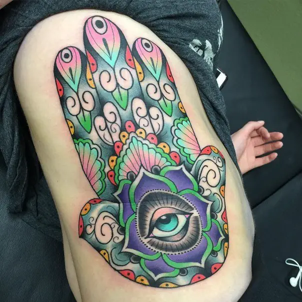 hamsa hand tattoo ribs