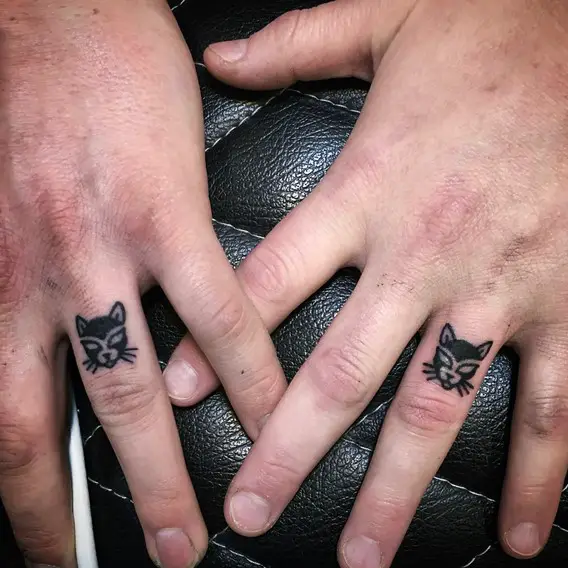 his and hers matching small cat finger tattoos