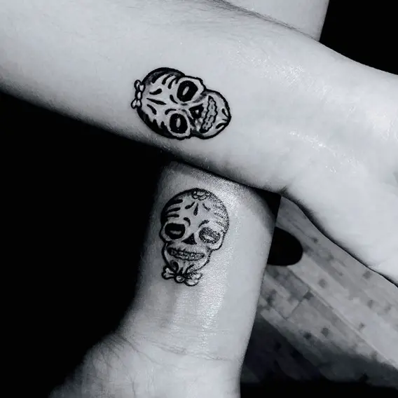 his and hers matching sugar skulls tattoos