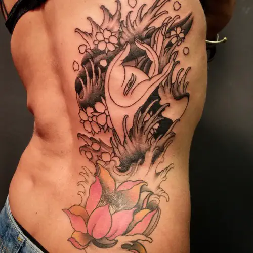 lotus tattoo lower back