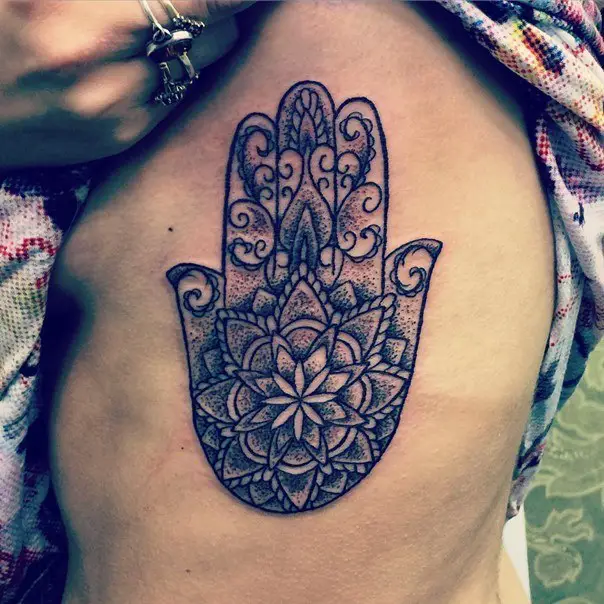 mandala hamsa hand tattoo on ribs