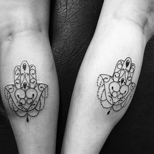 matching hamsa hand tattoos