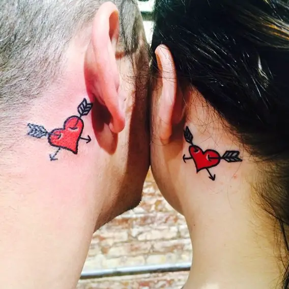 matching his and her tattoos behind the ears