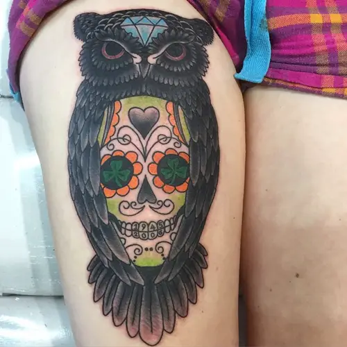 mexican skull with owl tattoo on thigh