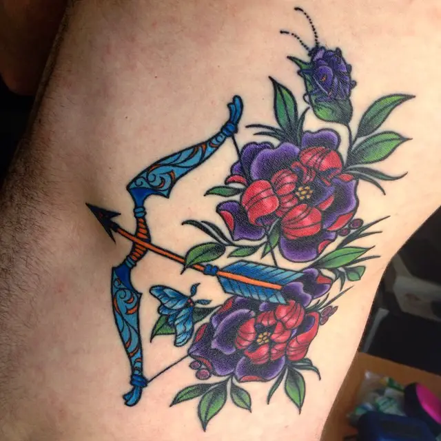 neo-traditional-bow-and-arrow-flower-tattoo