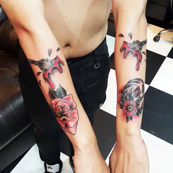 oldschool skull tattoo with rose and arrowhead