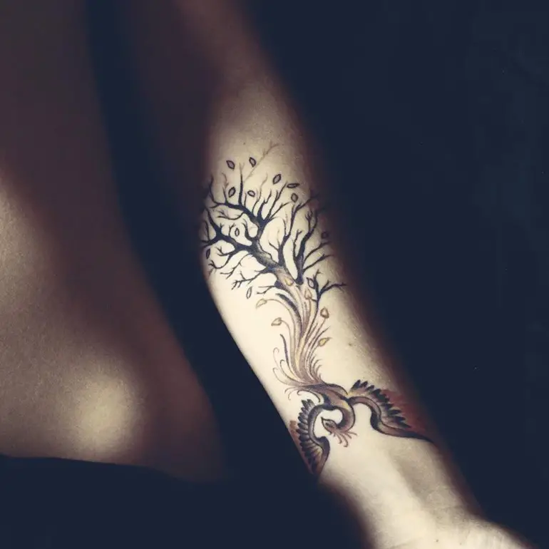 phoenix-tattoo-with-tree-on-forearm