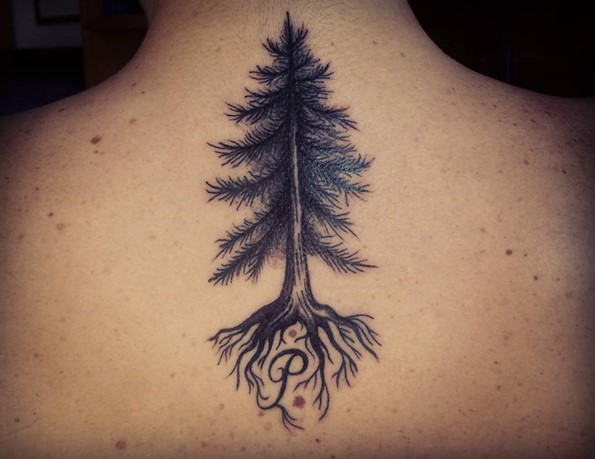 pine tree tattoo with word on back