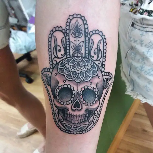 skull hamsa hand tattoos