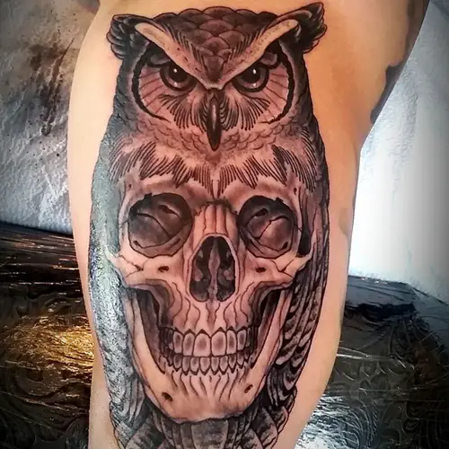 skull inside owl tattoo on sleeve