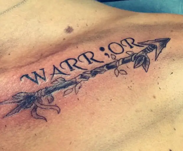 warrior semicolon collar bone tattoo male