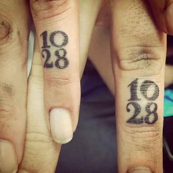 wedding ring tattoo with date