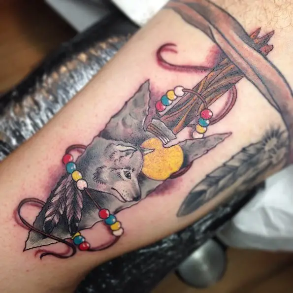 wolf inside arrowhead sleeve tattoo