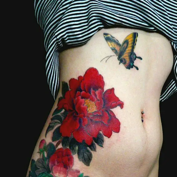 red flowers side tattoos for girls