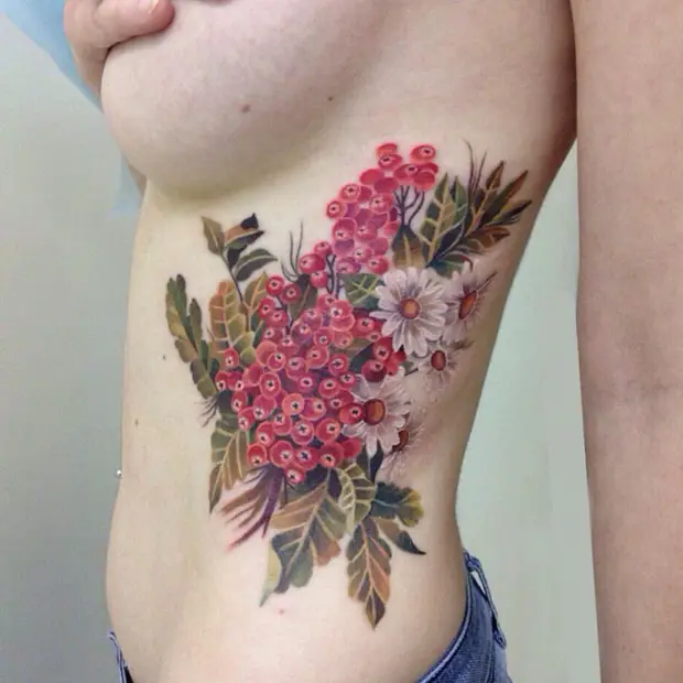 side tattoos female flowers