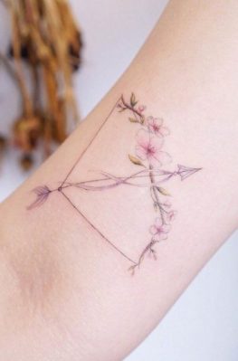 girly bow and arrow tattoo