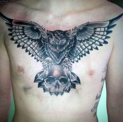 Owl and skull tattoo on chest