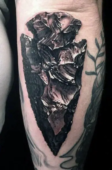 Realistic arrowhead tattoo