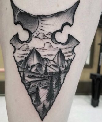 Simple arrowhead tattoo