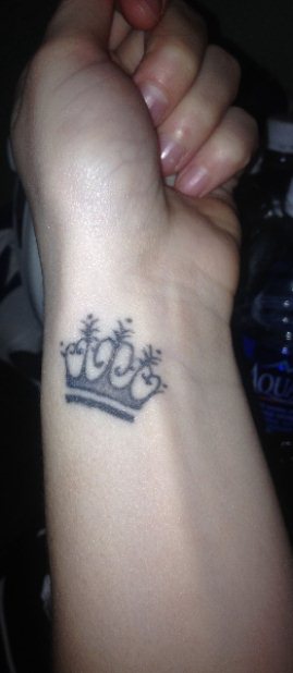 Small crown tattoos on wrist