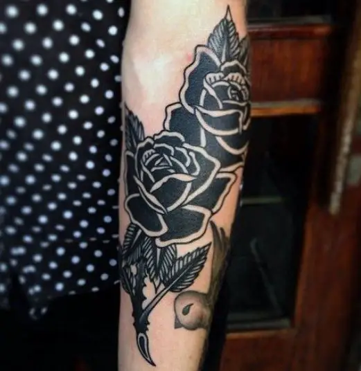 Traditional black rose tattoo